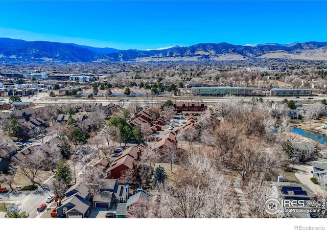 birds eye view of property featuring a mountain view