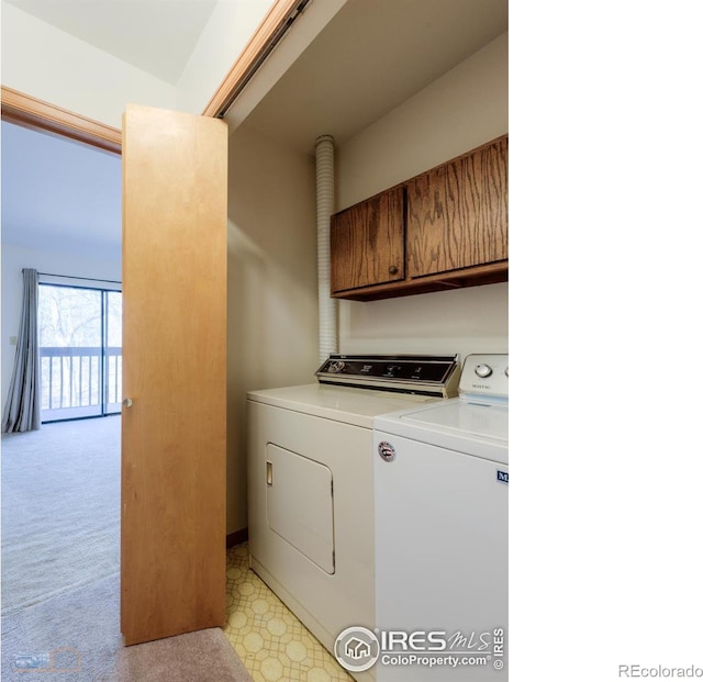 laundry area featuring washer and clothes dryer, laundry area, and light floors