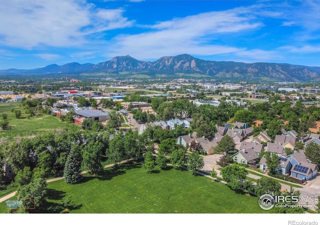 birds eye view of property with a mountain view