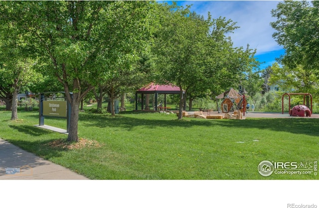 view of yard with a gazebo and playground community