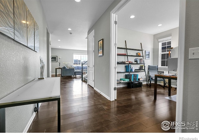 office with recessed lighting, baseboards, hardwood / wood-style floors, and a textured wall