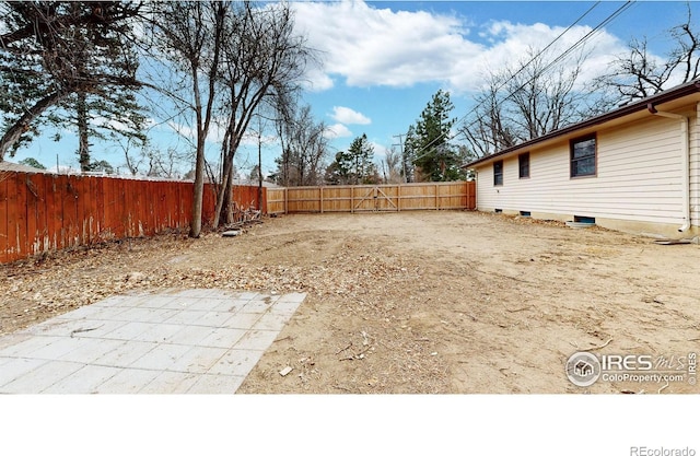 view of yard with a patio and a fenced backyard