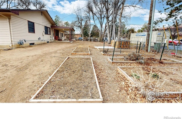 view of yard featuring a garden and fence