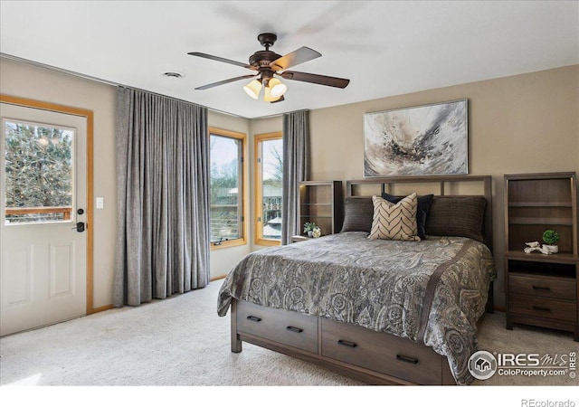 carpeted bedroom with ceiling fan