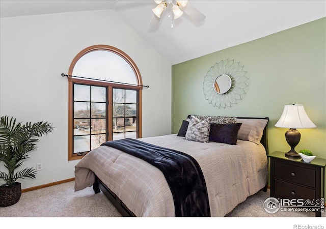 bedroom with baseboards, lofted ceiling, carpet, and ceiling fan