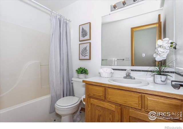 bathroom with shower / tub combo, toilet, and vanity