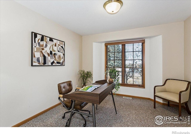 office featuring visible vents, baseboards, and carpet