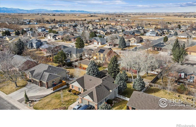 drone / aerial view with a mountain view and a residential view