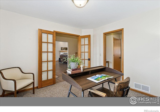 office with visible vents, baseboards, carpet flooring, and french doors