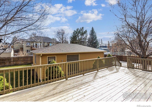 deck with fence and a residential view