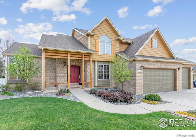 traditional home with brick siding, concrete driveway, a shingled roof, and a front lawn