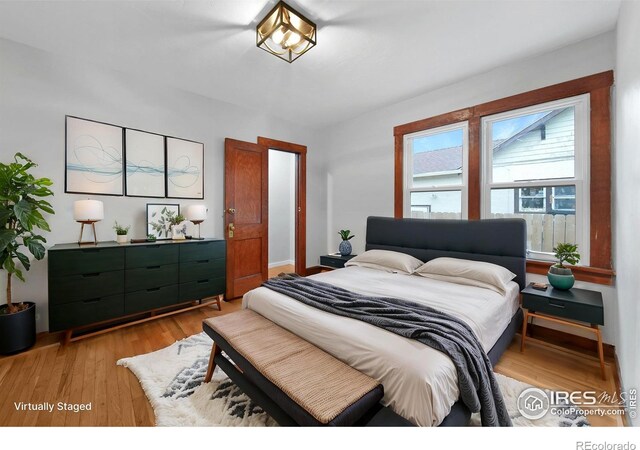 bedroom with light wood-style floors