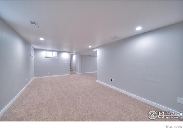 basement featuring recessed lighting, stairs, baseboards, and carpet floors