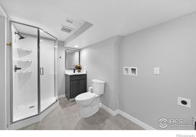 bathroom with visible vents, a shower stall, baseboards, toilet, and vanity