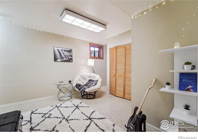 living area with speckled floor and baseboards