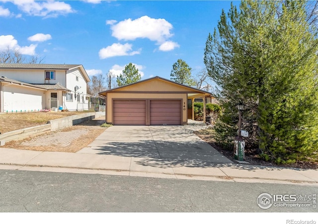 view of front of property featuring driveway and an attached garage