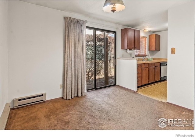 kitchen with a baseboard radiator, a sink, stainless steel dishwasher, light colored carpet, and brown cabinets