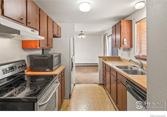 kitchen featuring white dishwasher, a sink, electric stove, under cabinet range hood, and a baseboard heating unit