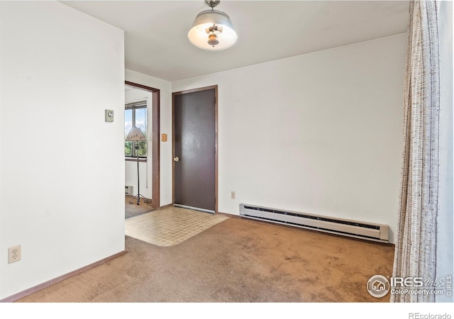 entrance foyer with carpet, baseboards, and baseboard heating