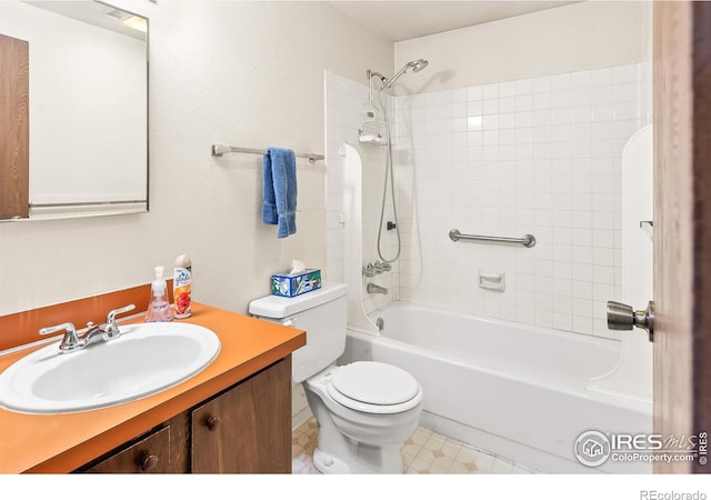 full bathroom with toilet, vanity, and shower / tub combination