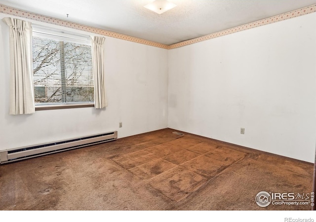 carpeted empty room with a textured ceiling and a baseboard radiator