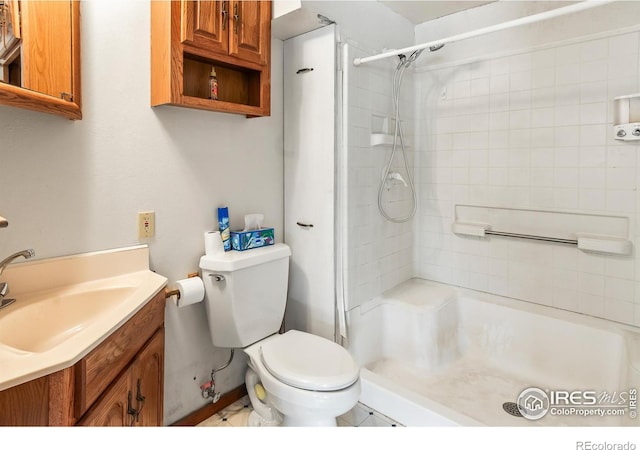 bathroom with toilet, vanity, and walk in shower