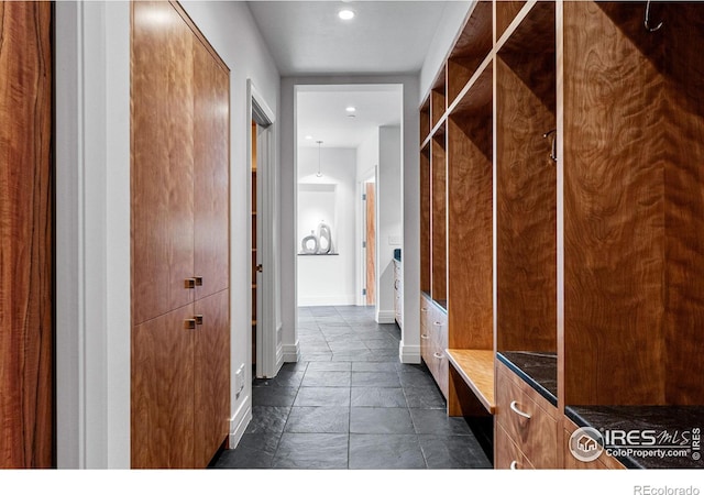 mudroom featuring baseboards