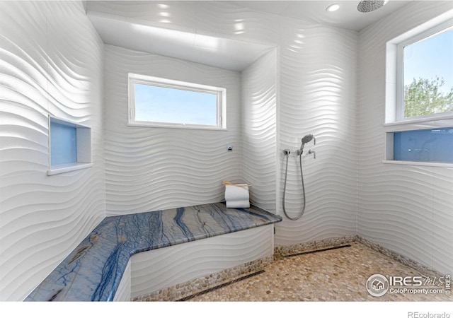 full bath with a tile shower