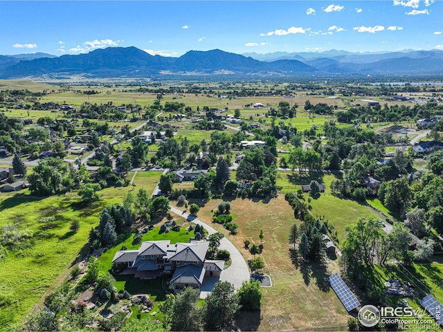 birds eye view of property with a mountain view