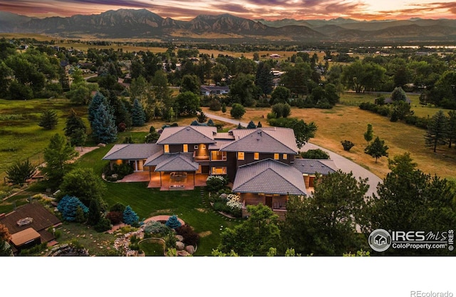 aerial view at dusk with a mountain view