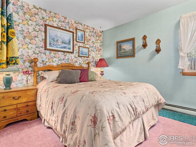 177 Bill Waite Rd, Allenspark, CO 80510 - bedroom with carpet, a baseboard heating unit, and wallpapered walls