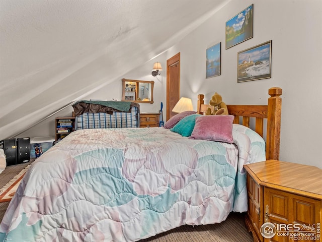 177 Bill Waite Rd, Allenspark, CO 80510 - bedroom with lofted ceiling and carpet