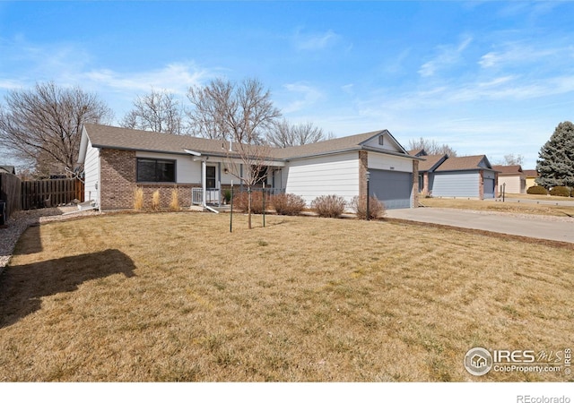 ranch-style home featuring a garage, brick siding, concrete driveway, and a front yard