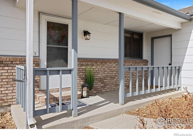 doorway to property featuring a porch