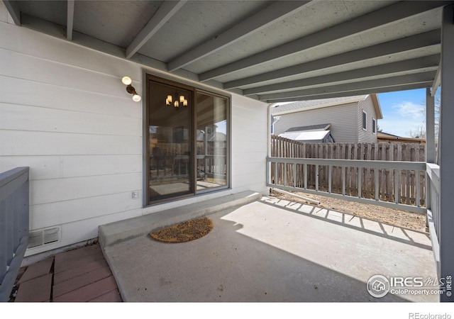 view of patio / terrace featuring fence