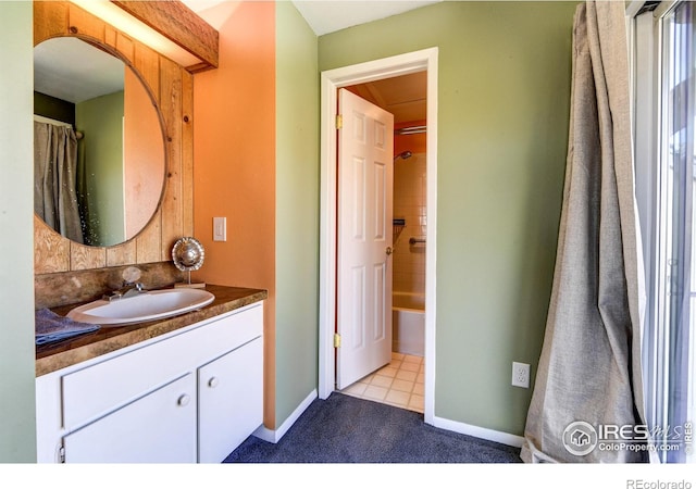 full bathroom featuring baseboards, vanity, and shower / bath combination with curtain