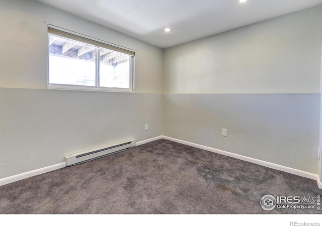 carpeted spare room with recessed lighting, a baseboard heating unit, and baseboards