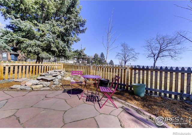 view of patio / terrace featuring outdoor dining area and fence