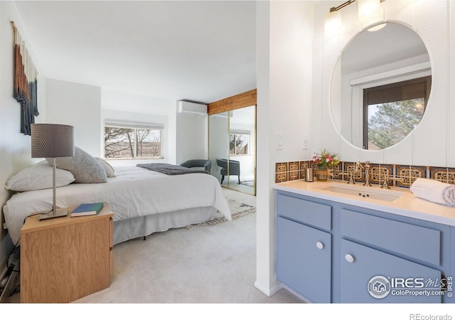 bedroom featuring light colored carpet and a sink