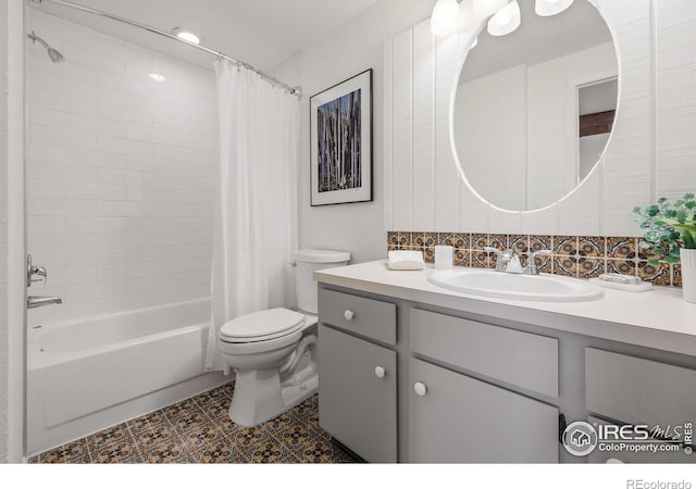 full bathroom with vanity, toilet, and shower / tub combo with curtain