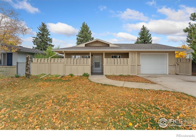 single story home with driveway, brick siding, an attached garage, and fence