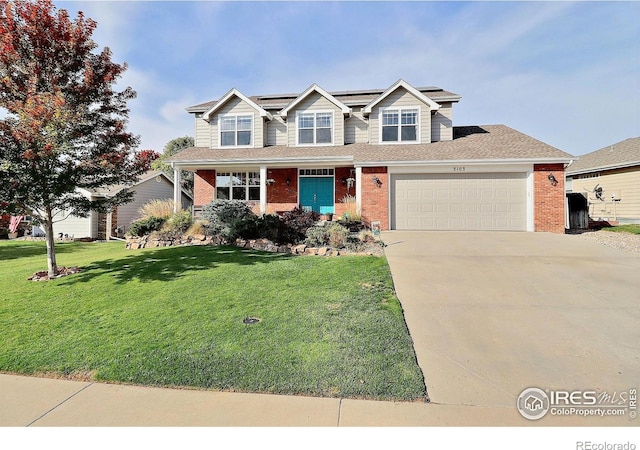 view of front of property featuring brick siding, roof mounted solar panels, a garage, and a front yard