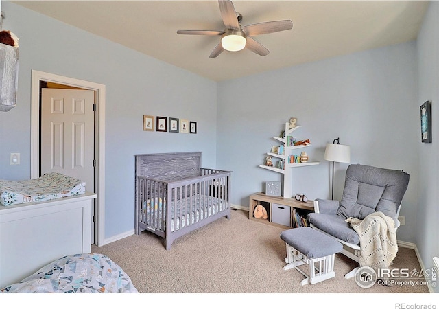 carpeted bedroom featuring ceiling fan and baseboards