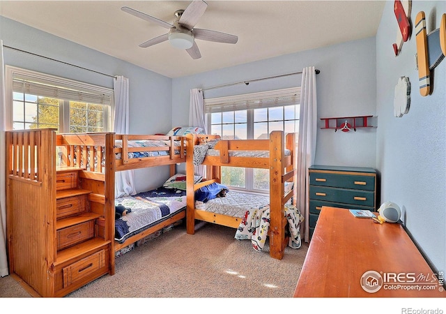 bedroom with ceiling fan and carpet floors