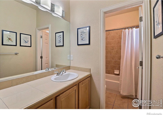 bathroom featuring tile patterned floors, vanity, and shower / bath combination with curtain