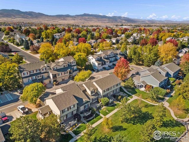 drone / aerial view featuring a mountain view and a residential view