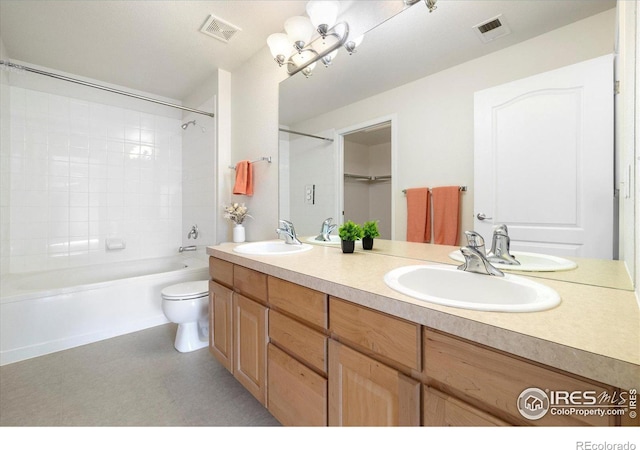 full bath with visible vents, toilet, and a sink