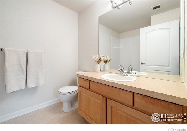 bathroom featuring vanity, toilet, baseboards, and visible vents