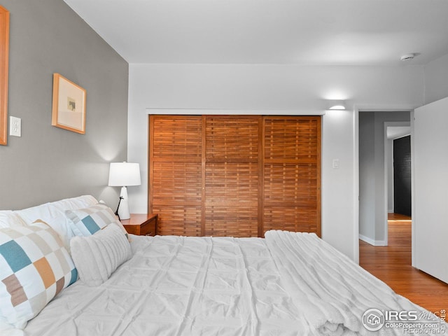 bedroom with wood finished floors