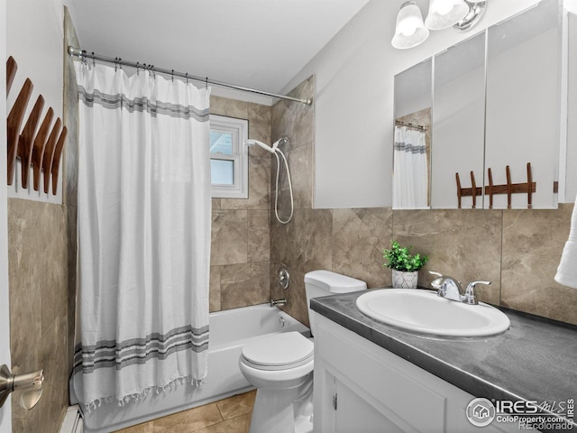 bathroom featuring tile patterned flooring, tile walls, toilet, shower / tub combo with curtain, and vanity